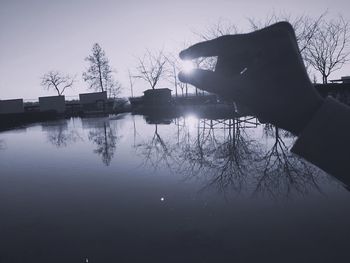 Reflection of trees in calm lake