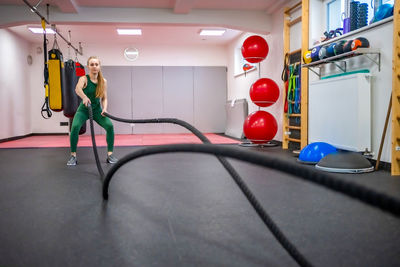 Rear view of man exercising in gym