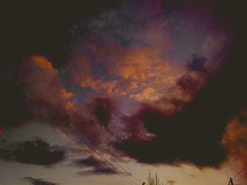 Low angle view of dramatic sky during sunset