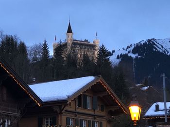 Houses against sky during winter