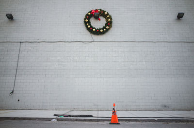 Low angle view of christmas wreath on building