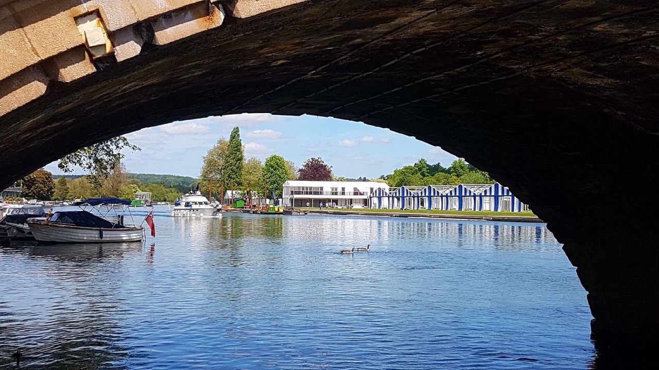 water, architecture, built structure, bridge, transportation, arch, waterfront, bridge - man made structure, connection, nature, nautical vessel, day, river, reflection, travel, plant, tree, building exterior, mode of transportation, no people, outdoors, arch bridge, architectural column, passenger craft