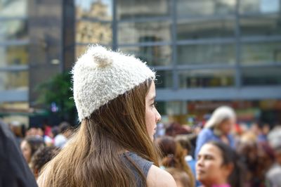 Woman with long hair wearing knit hat