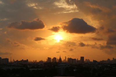 Cityscape against sky during sunset