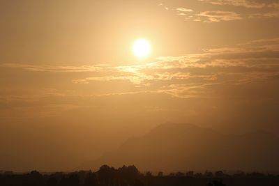 Scenic view of silhouette mountains against sky during sunset