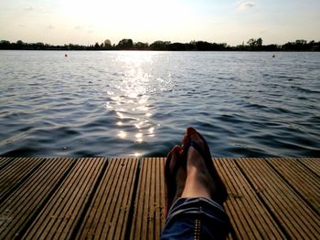 Low section of man on rippled water