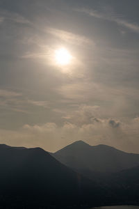 Scenic view of silhouette mountains against sky during sunset