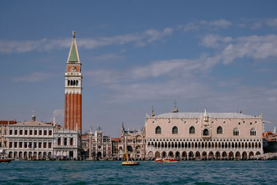 View of buildings against cloudy sky
