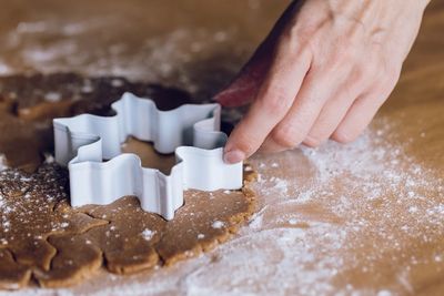 Midsection of woman holding cookies