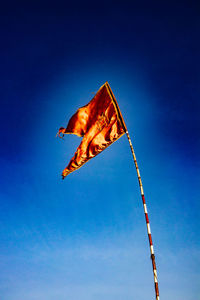 Low angle view of flag against sky