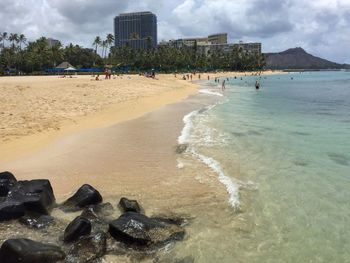 View of beach against cloudy sky