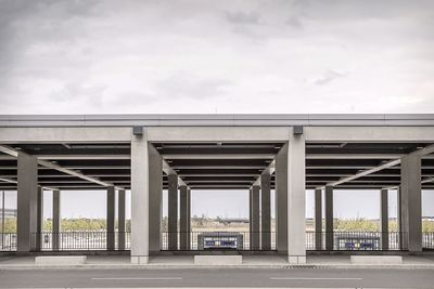 Low angle view of bridge against sky in city