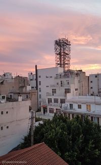 Buildings against sky during sunset