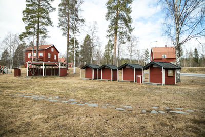 Houses in barn against sky