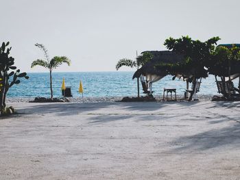 Scenic view of beach against clear sky