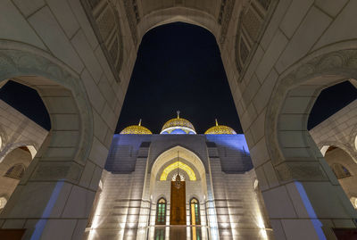 Low angle view of illuminated building at night