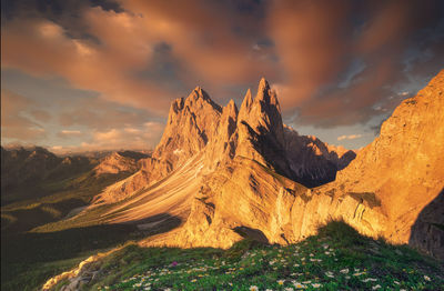 Scenic view of rocky mountains against sky during sunset