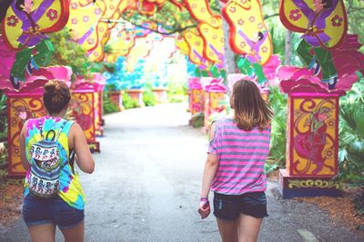 Woman standing on footpath