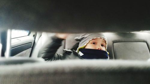 Young woman sitting in car