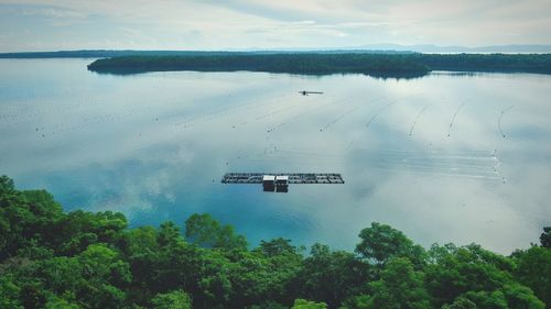 High angle view of boats in sea against sky