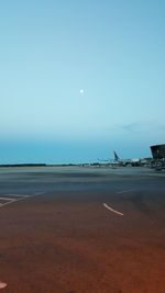 Scenic view of beach against clear sky