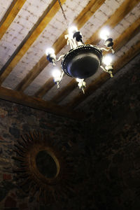 Low angle view of illuminated ceiling