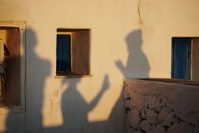 Shadow of man on wall of building