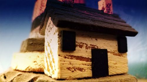 Close-up of old abandoned building against sky during winter