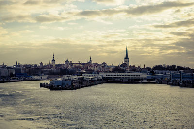 View of buildings against cloudy sky