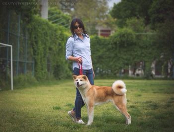 Dog standing on field