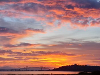 Scenic view of dramatic sky over sea during sunset