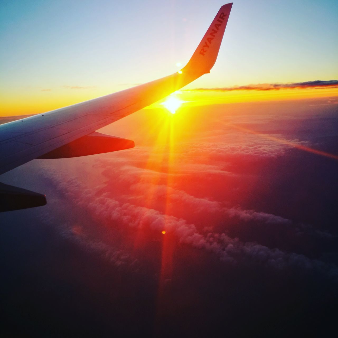 sunset, airplane, transportation, mode of transport, travel, flying, nature, aircraft wing, sky, beauty in nature, air vehicle, landscape, sunlight, no people, airplane wing, journey, sun, sunbeam, scenics, outdoors, day