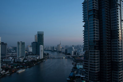 Modern buildings in city against sky