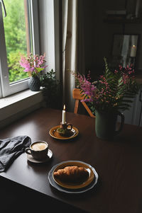 High angle view of illuminated candles on table