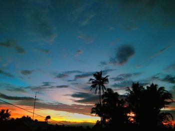 Low angle view of silhouette trees against sky during sunset