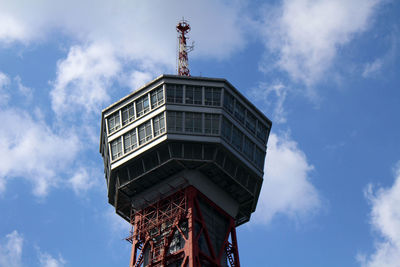 Low angle view of building against cloudy sky