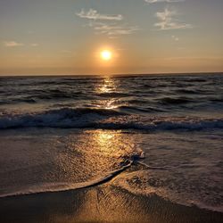 Scenic view of seascape against sky during sunset