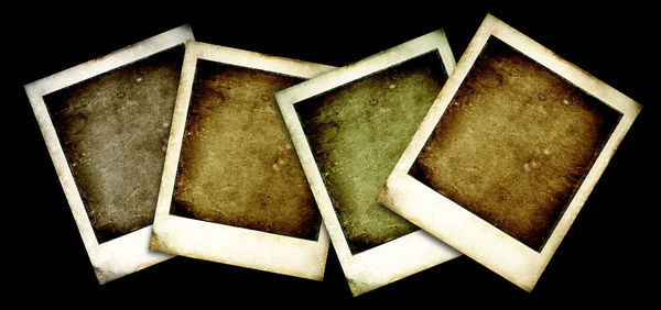 High angle view of old paper against black background