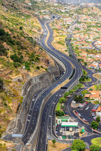 High angle view of vehicles on road in city