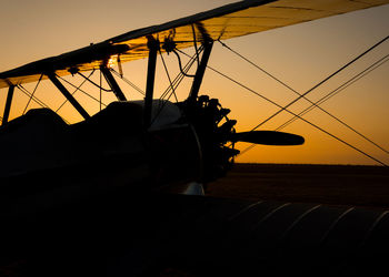 Low angle view of silhouette boat against sky during sunset