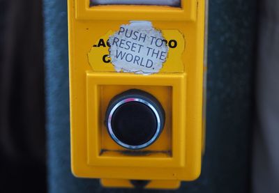 Close-up of yellow text on door