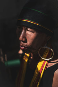 Close-up portrait of man wearing hat