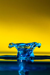 Close-up of water drops on glass against black background