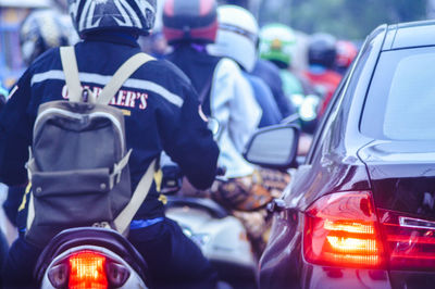 People on motorcycle during traffic