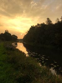 Scenic view of lake against sky during sunset