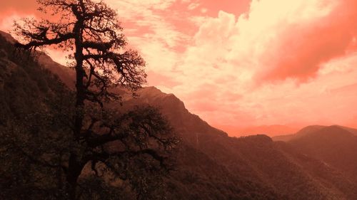 Scenic view of mountains against sky at sunset