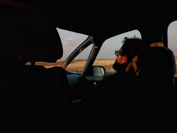Woman sitting in car