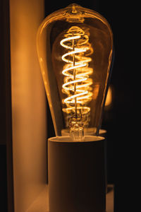 Close-up of illuminated light bulb