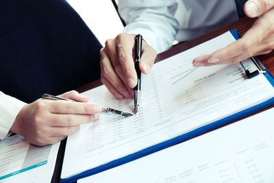 Low angle view of man working on paper