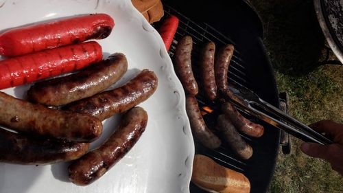 High angle view of meat on barbecue grill